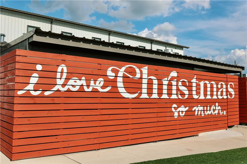 The red 'i love Christmas so much' wall outside the Madisonville flagship